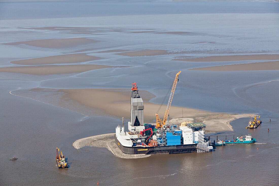 Aerial view of the construction of a wind turbine in the North Sea, Lower Saxony, Germany
