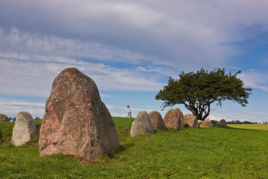 Megalithic grave at Tromper Wieck under clouded sky, Wittow peninsula, Island of Ruegen, Mecklenburg Western Pomerania, Germany, Europe