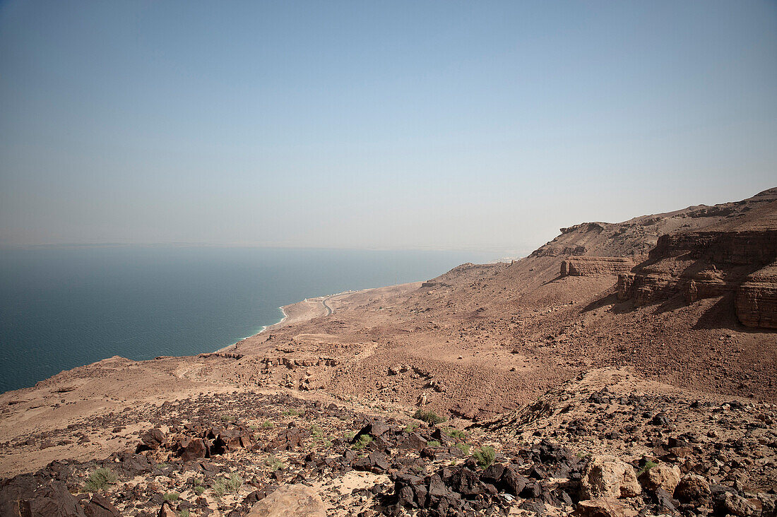 View of the Dead Sea and rough rocks in the sunlight, Jordan, Middle East, Asia