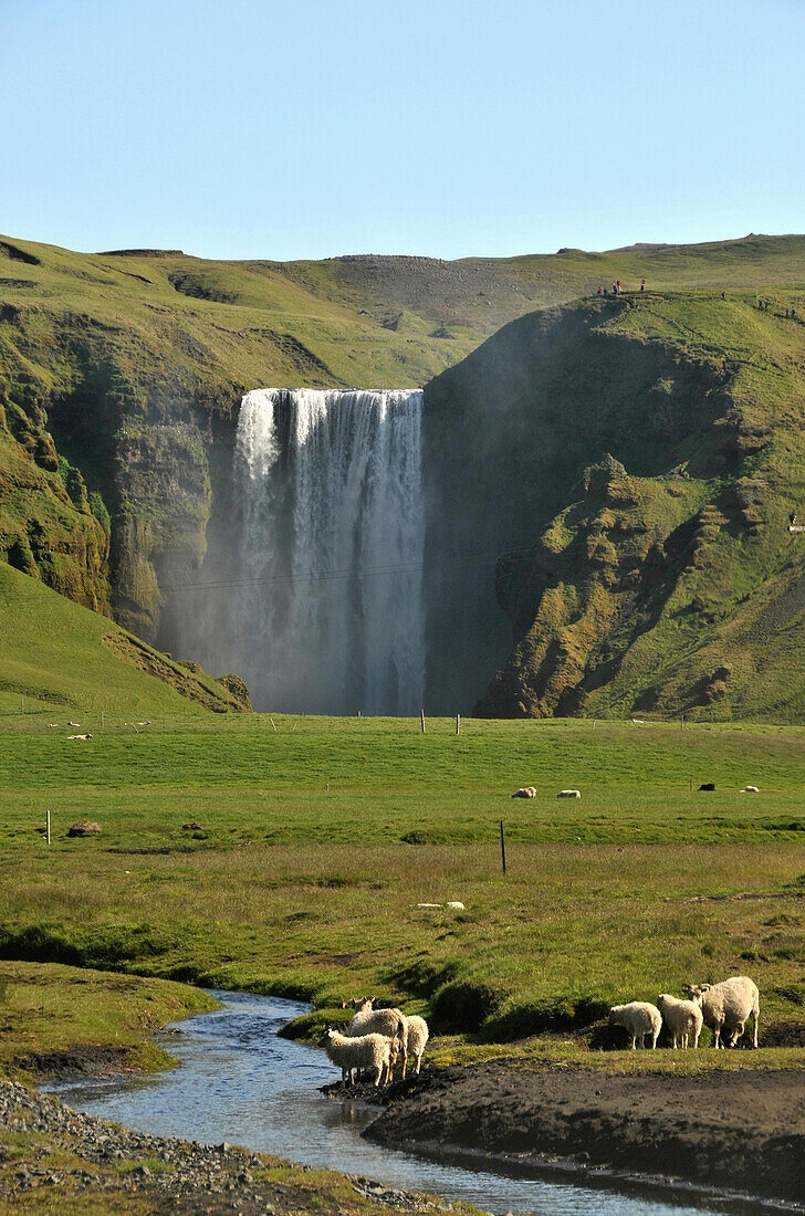 The Skogar waterfall at the coast underneath of the Porsmoerk vulkano, South Iceland, Europe