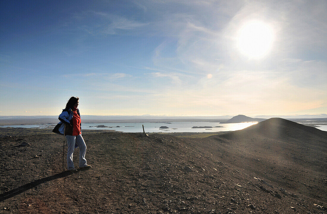 Hiker on Hverfel vulkano near lake Myvatn, Skutustadir, Nordurland eystra, Iceland