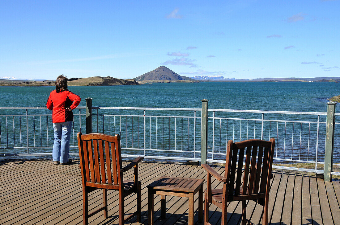 Woman looking over Myvatn lake, Skutustadir, Nordurland eystra, Iceland