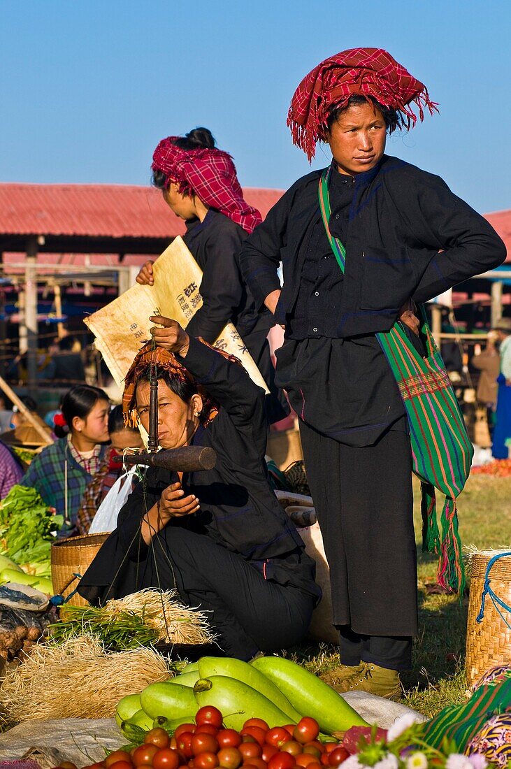 Myanmar (Burma), Shan State, Inle Lake, village of Nam Hu, near the Paya Paung Daw Oo, market, Paho women selling vegetables