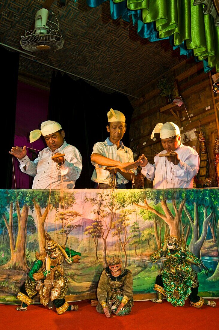 Myanmar (Burma), Mandalay State, Mandalay, Mandaly Puppets, the owner of the theatre Than Nyunt (on the left), Uten Saung and his brother Thein Lwin (on the right) operate puppets on stage to play the Zat Pwe legends  ( buddhic jataka) and Yamazat legends