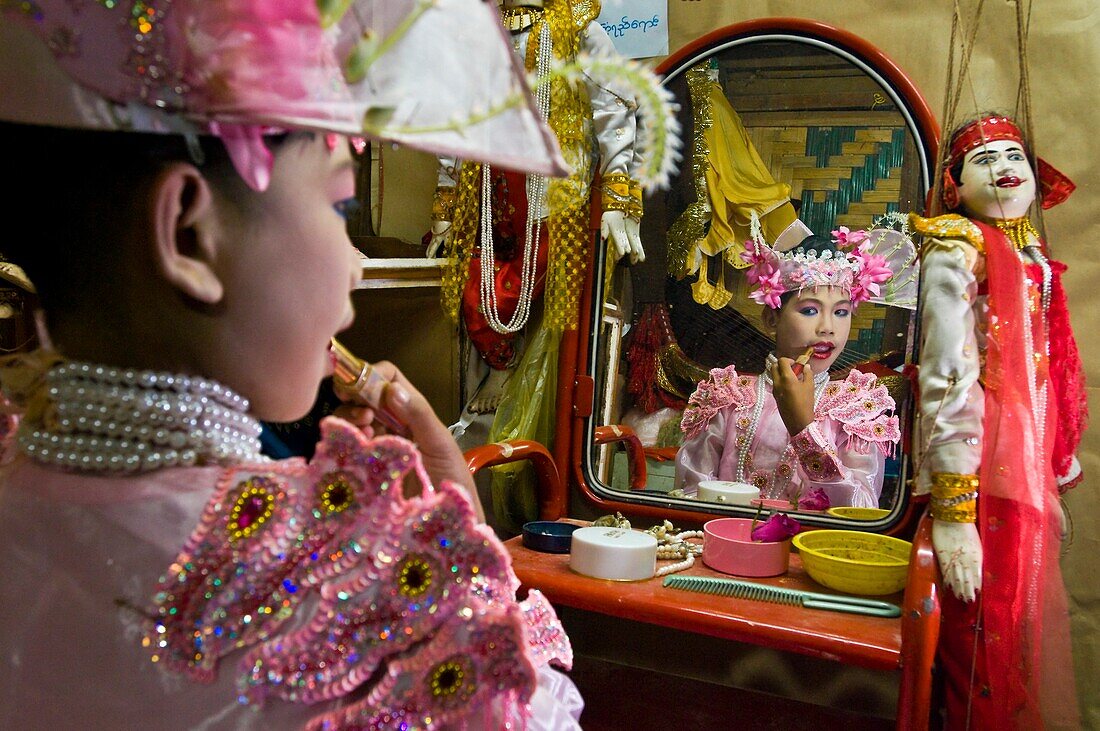 Myanmar (Burma), Mandalay State, Mandalay, Mandaly Puppets, the young dancer Myint Kyaw Soe reading himself to get on stage