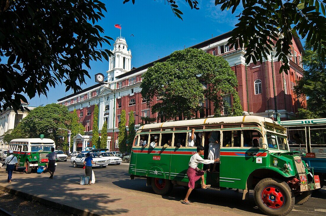 Myanmar (Burma), Yangon State, Yangon, Strand avenue, Custom House, a chevelet, a wooden bus of the second world war in front of the colonial building testifying the British Empire influence between 1886 and 1947