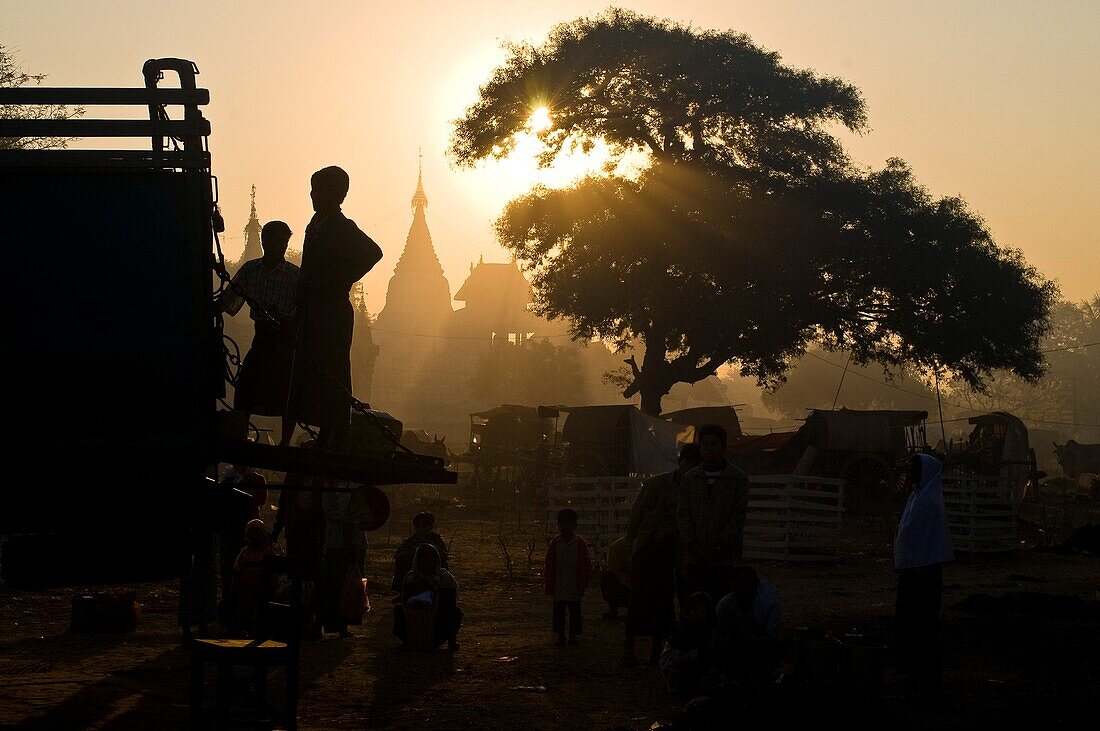 Myanmar (Burma), Mandalay State, Bagan (Pagan), Old Bagan, the sun rises on the old capital of the Pagan kingdom founded in 849 and on the movements of the Burmese makeshift camps here to participate at the festival