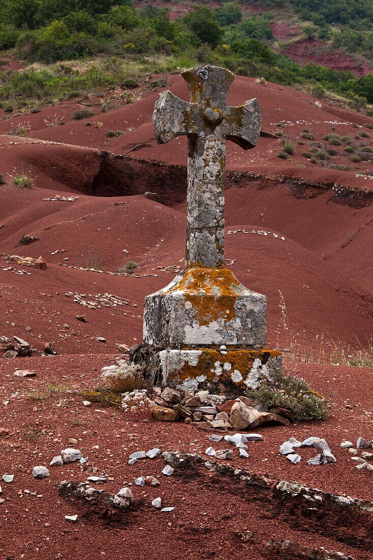 France, Aveyron, Rougier de Camarès, cross made of stone on red soil