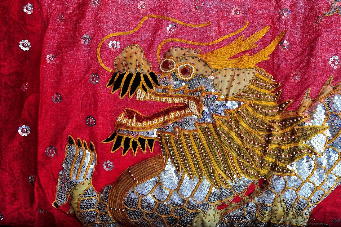 Asia, Southeast Asia, Laos, Luang Prabang, fabric with a dragon on it