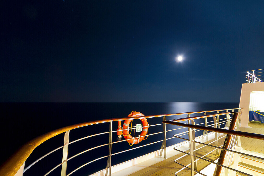 Ship Deck at Night With Moon Above