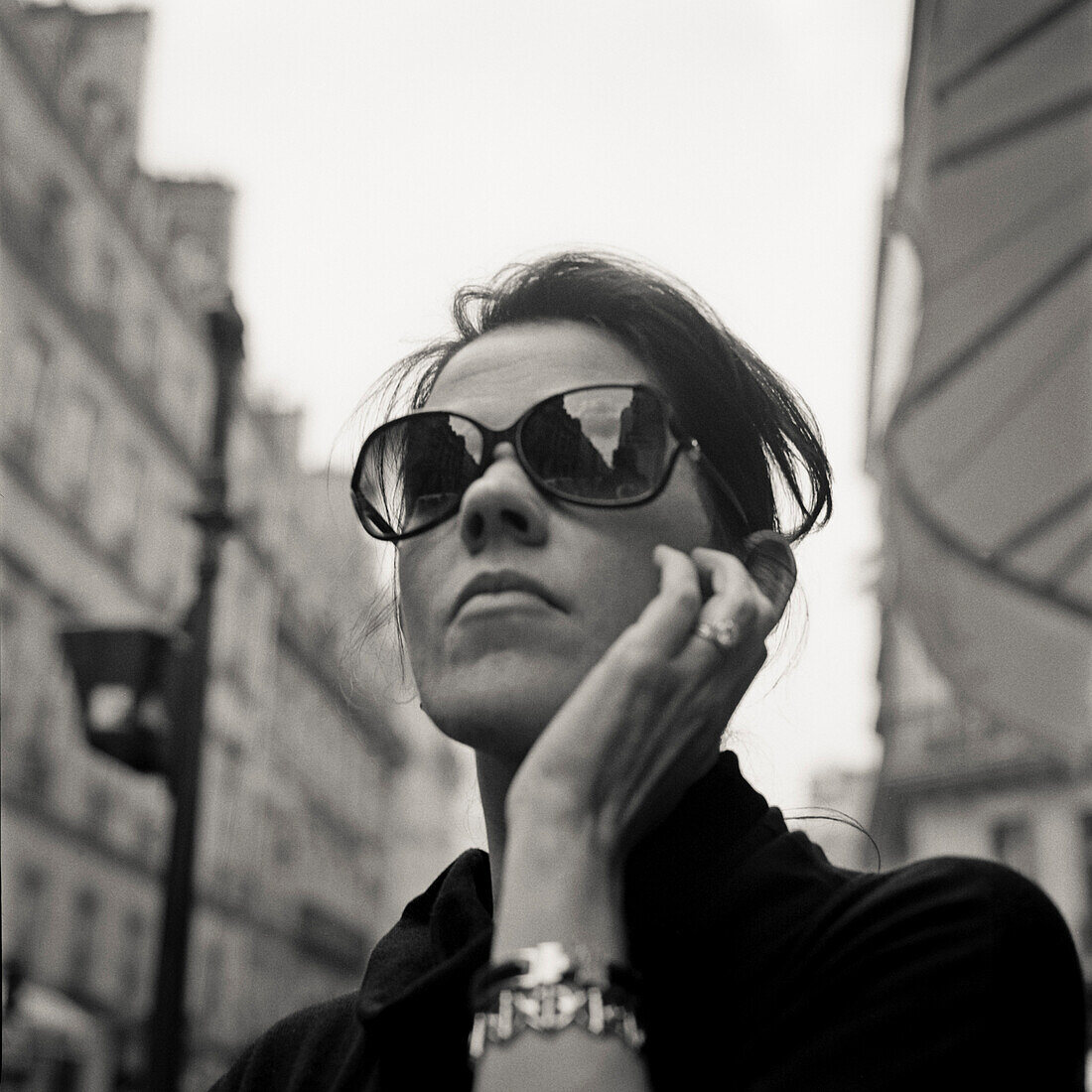 Woman Wearing Dark Sunglasses, Portait, Low Angle View, Paris, France