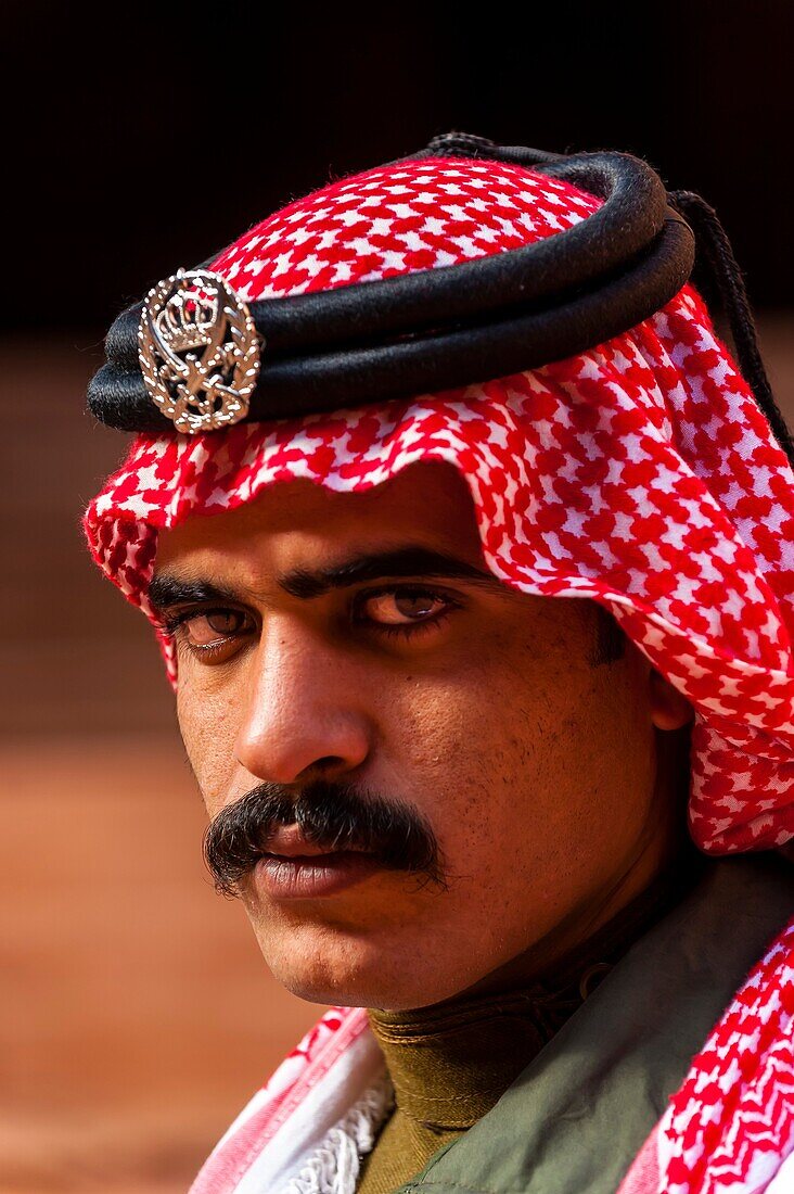 A Bedouin Desert Patrol policeman at the Treasury monument Al-Khazneh, Petra archaeological site a UNESCO World Heritage site, Jordan