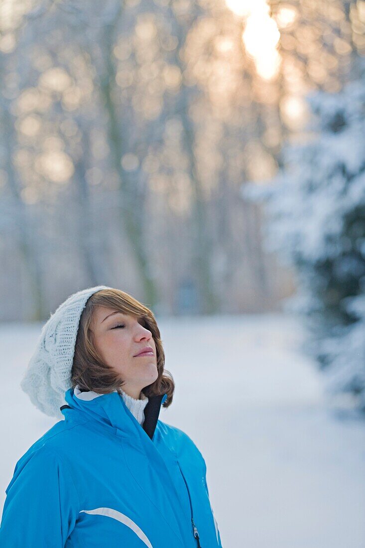Woman relaxing in a park in Winter