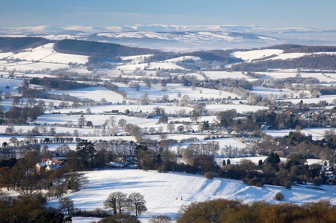 View across the Winter landscape viewed from the Malvern Hills looking across to the Black Mountains and the Brecon Beacons in the Distance