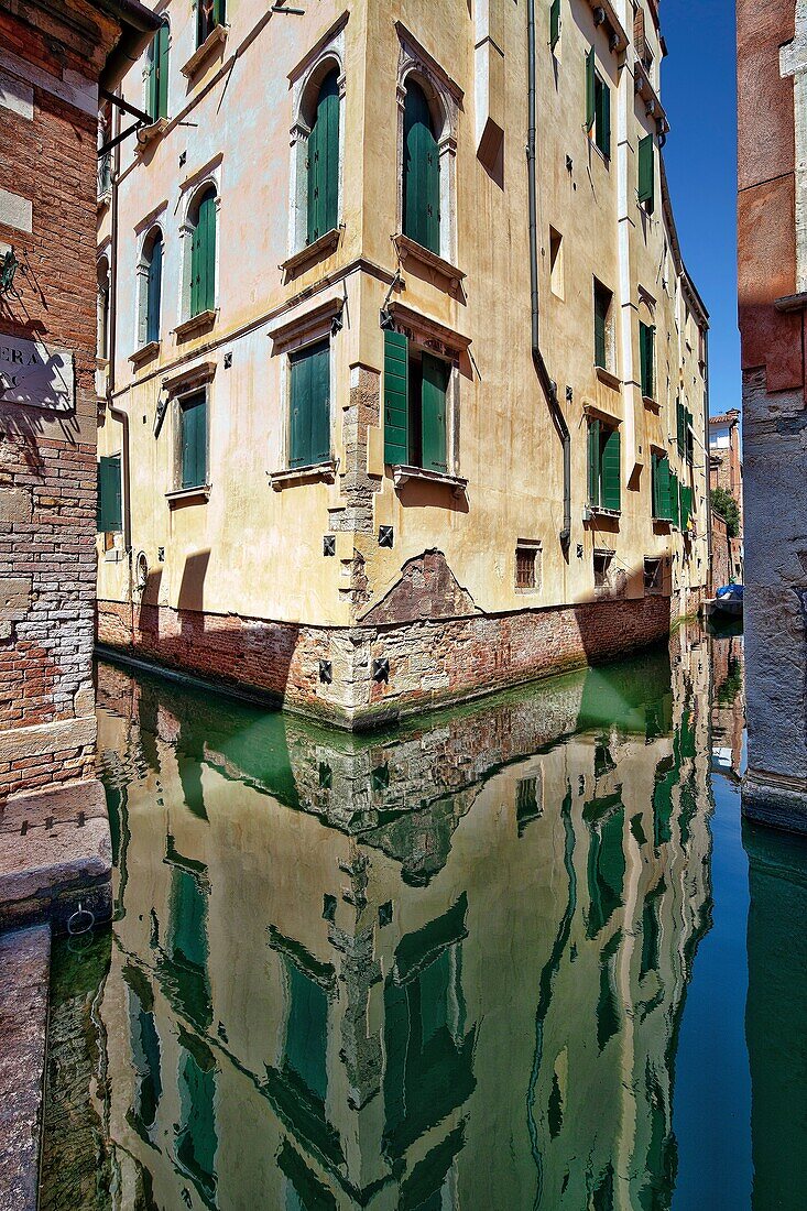 Building reflected on a canal, San Polo, Venice, Italy