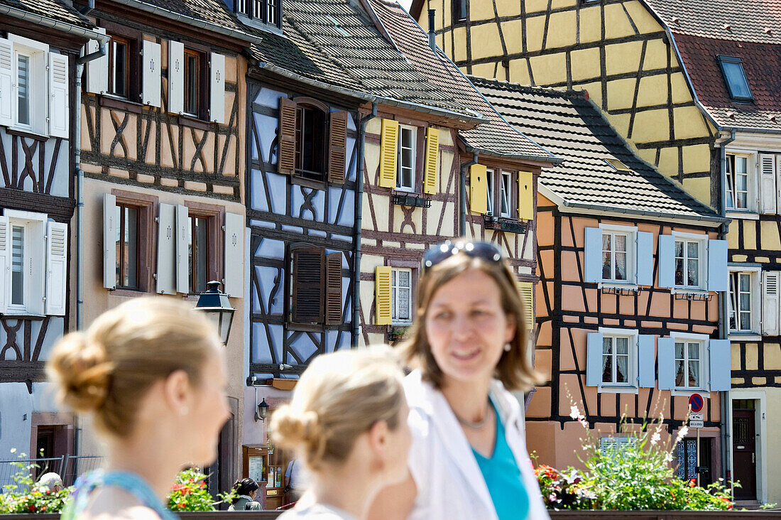 Mother and daughters in Petite Venise, Colmar, Alsace, France