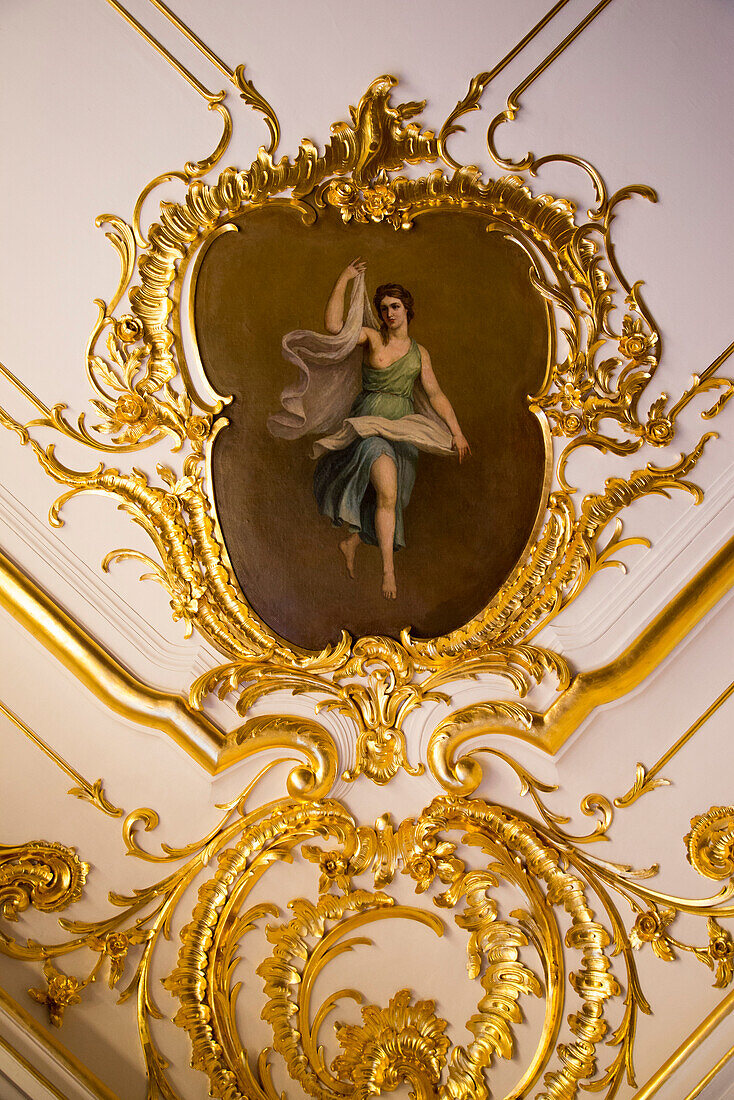 Golden decoration and painting on ceiling inside Catherine Palace, Tsarskoye Selo, Pushkin, near St. Petersburg, Russia, Europe