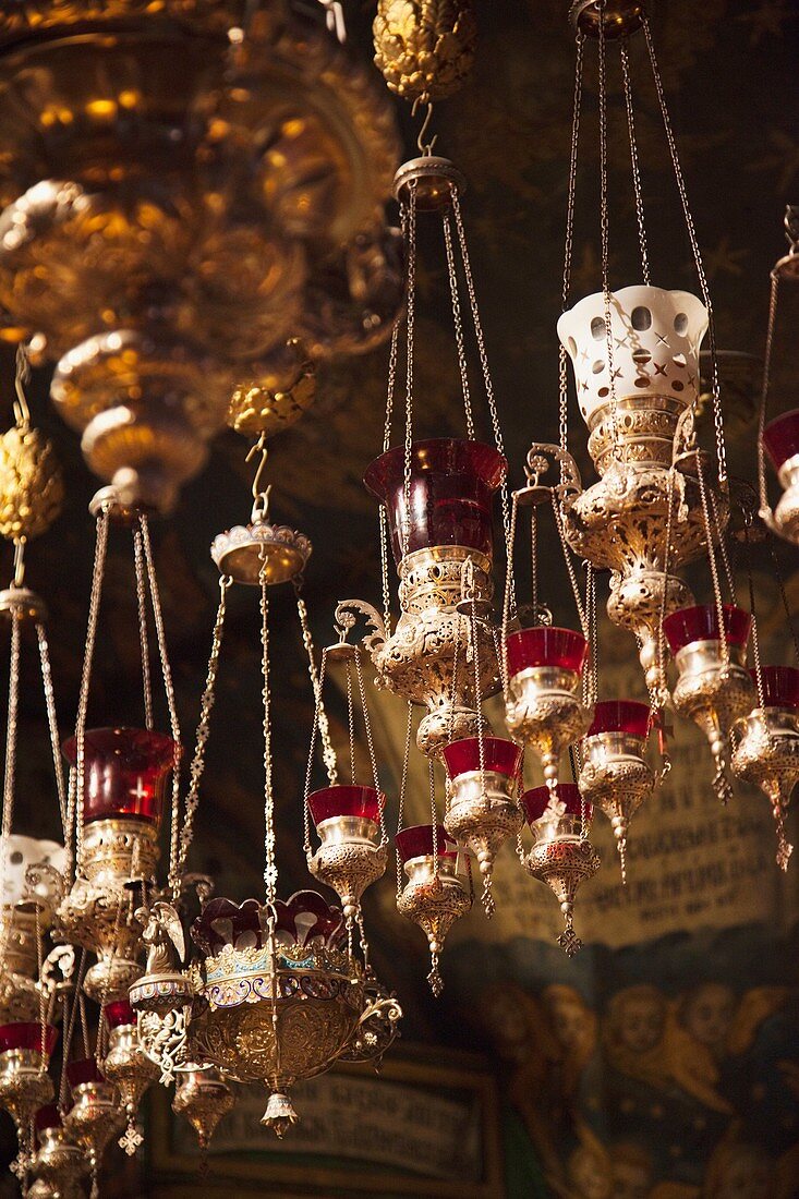 Israel, Jerusalem, Old City, Christian Quarter, Church of the Holy Sepulchre, interior with votive candles