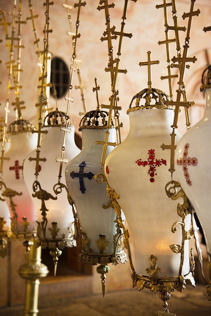 Israel, Jerusalem, Old City, Christian Quarter, Church of the Holy Sepulchre, interior with crosses and lanterns