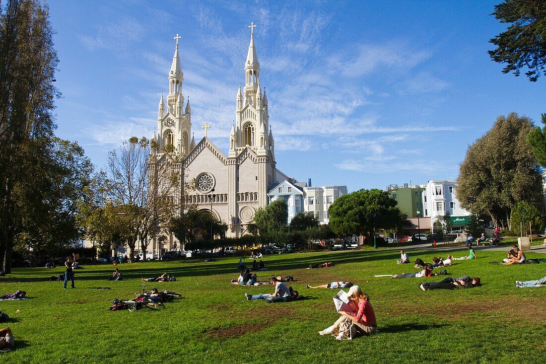 Sunday Afternnon Relaxation, Washington Square with view of Saints Peter and Paul Catholic Church, San Francisco, California, USA