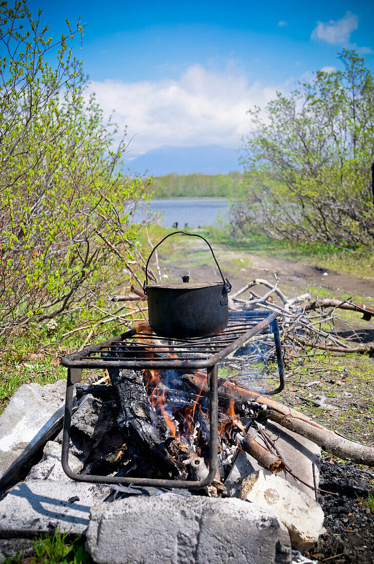 Cooking fish soup, Ukha, over a fire, Kamtschatka, Russia