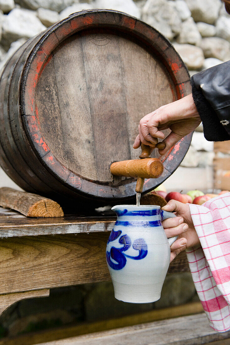 Apple apple cider in a wooden barrel, Homemade, Bavaria, Germany