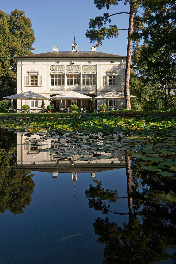 Pond and house at Merian Park, Brueglingen, Basel, Switzerland, Europe