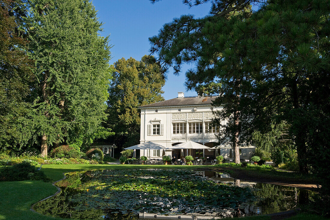 Pond and house at Merian Park, Brueglingen, Basel, Switzerland, Europe