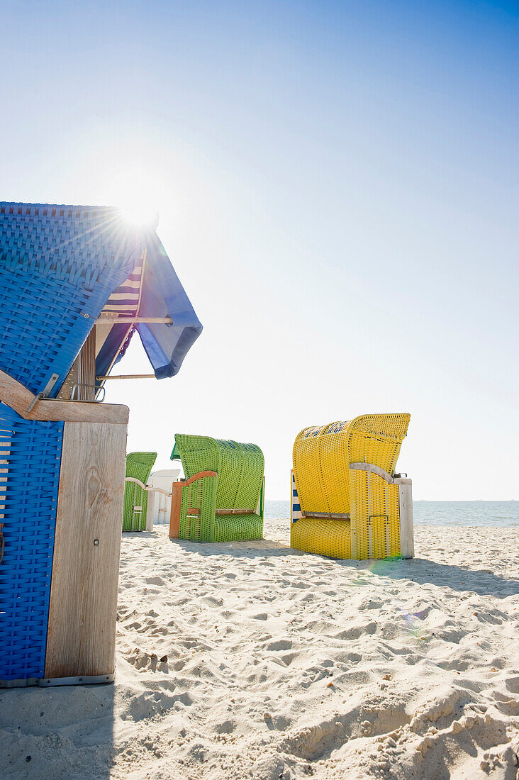 Colourful beachchairs on the beach in the sunlight, Wyk, Foehr, North Frisian Islands, Schleswig-Holstein, Germany, Europe