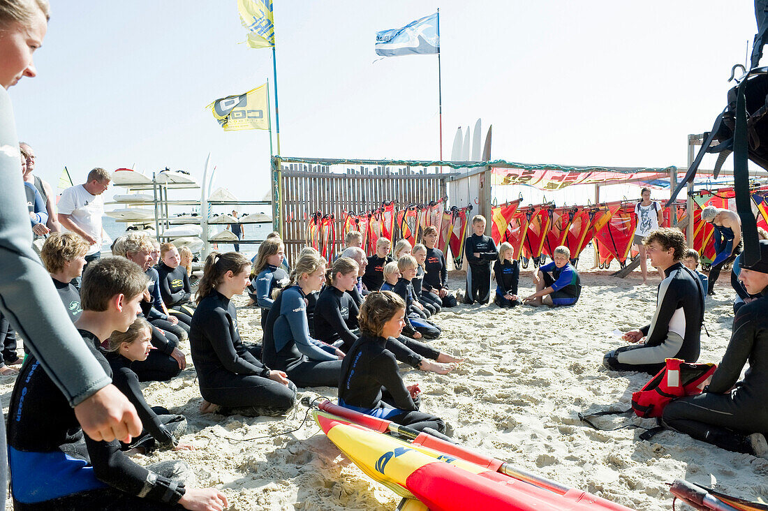 Children at a sailboarding school on the beach, Wyk, Foehr, North Frisian Islands, Schleswig-Holstein, Germany, Europe