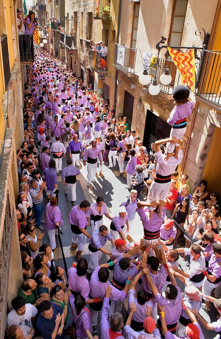 Colla Jove Xiquets de Tarragona ´Castellers´ human tower walking, a Catalan tradition Festa de Santa Tecla, city festival  Carrer Major Tarragona, Spain