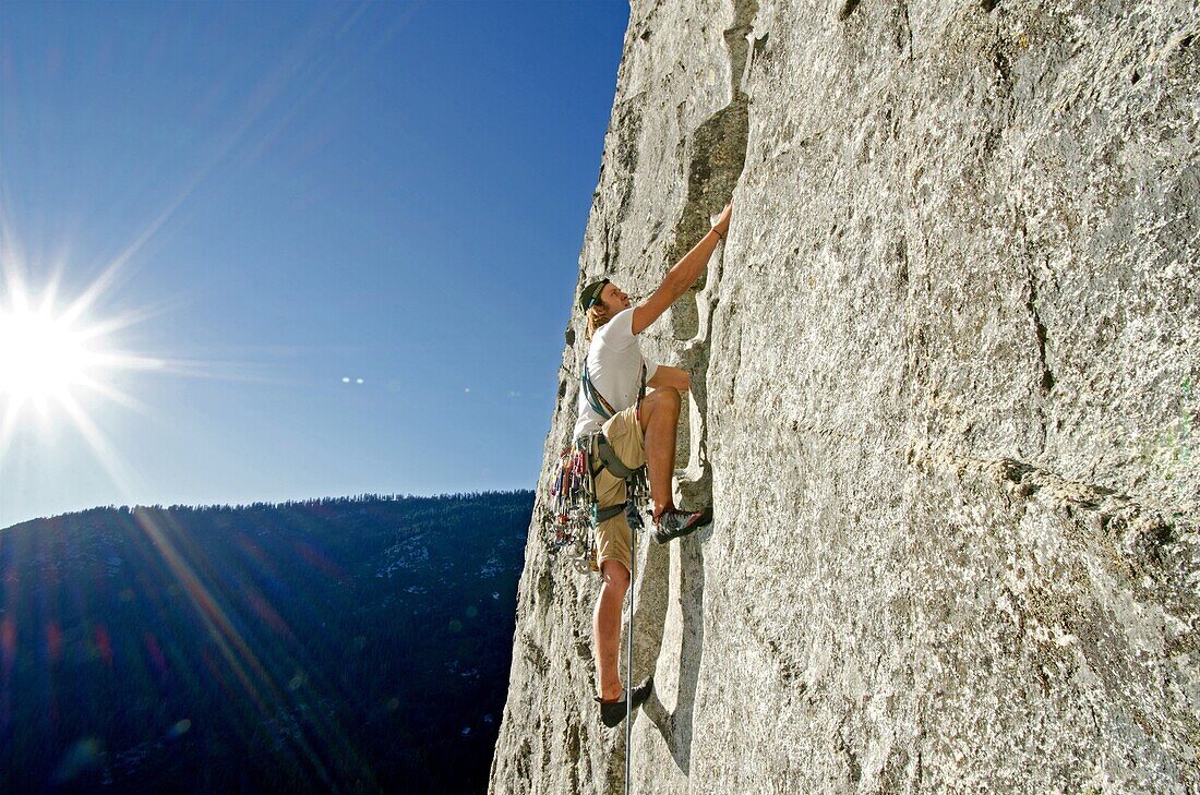 Nic Houser rock climbing a route called Corrugation Corner which is rated 5,7 and located at Lovers Leap near Lake Tahoe in northern California