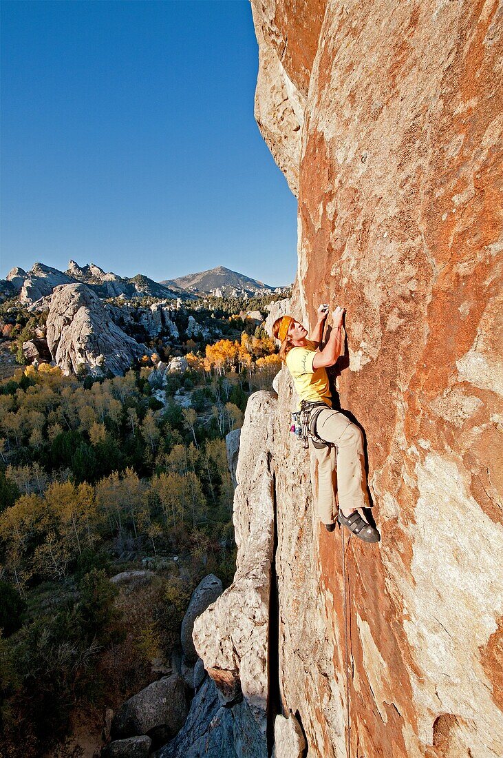 Nic Houser rock climbing a route called Firewater which is rated 5,11 and located on Flaming Rock at the City Of Rocks National Reserve near the town of Almo in southern Idaho