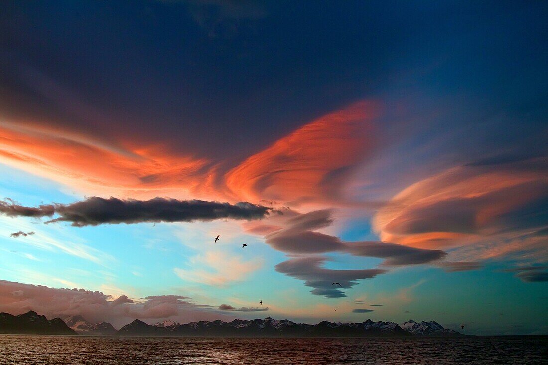 Interesting cloud formations forming over the island of South Georgia in the Southern Ocean. Interesting cloud formations forming over the island of South Georgia in the Southern Ocean  MORE INFO South Georgia is a British overseas territory in the southe