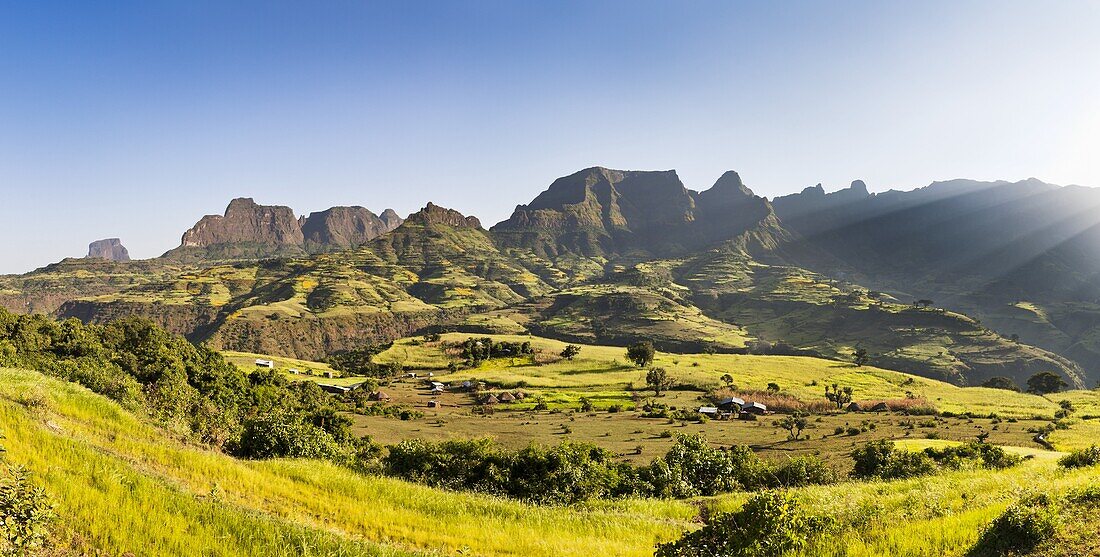 Panorama of a landscape near the escarpment of the Simien Mountains close to the Simien Mts  National Park near the village of Mekarebya at an elevation of about 2300m during the end of the rainy season  This area is heavily used for farming especially th