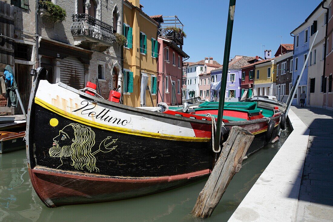 Boat ´Nettuno´ mooring in the canal in Burano, Venice, Italy