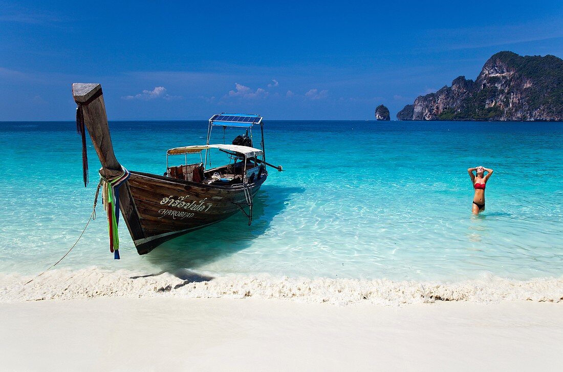 Long-Tail Boat and Woman on Ko Phi-Phi Island, Thailand