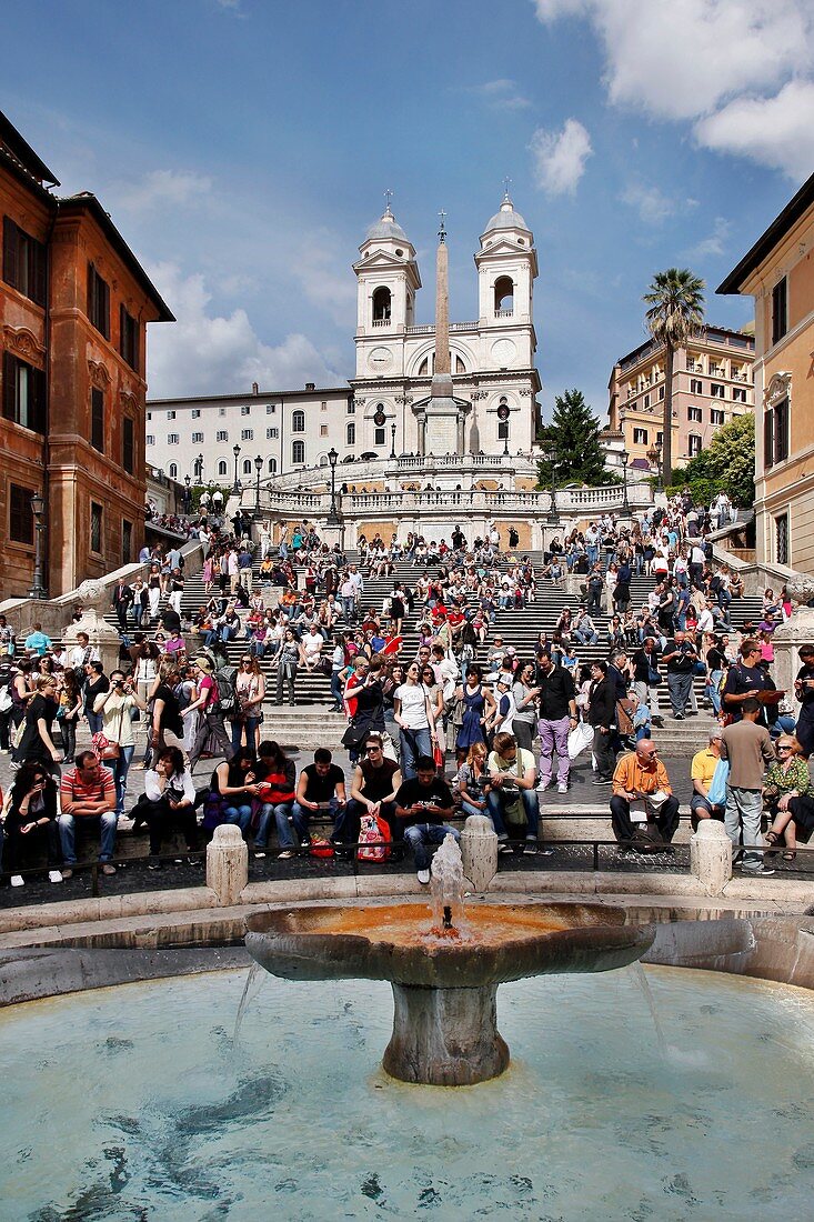 Vertical of tourists enjoying the Spanish Steps Piazza Di Spagna in Rome, Italy
