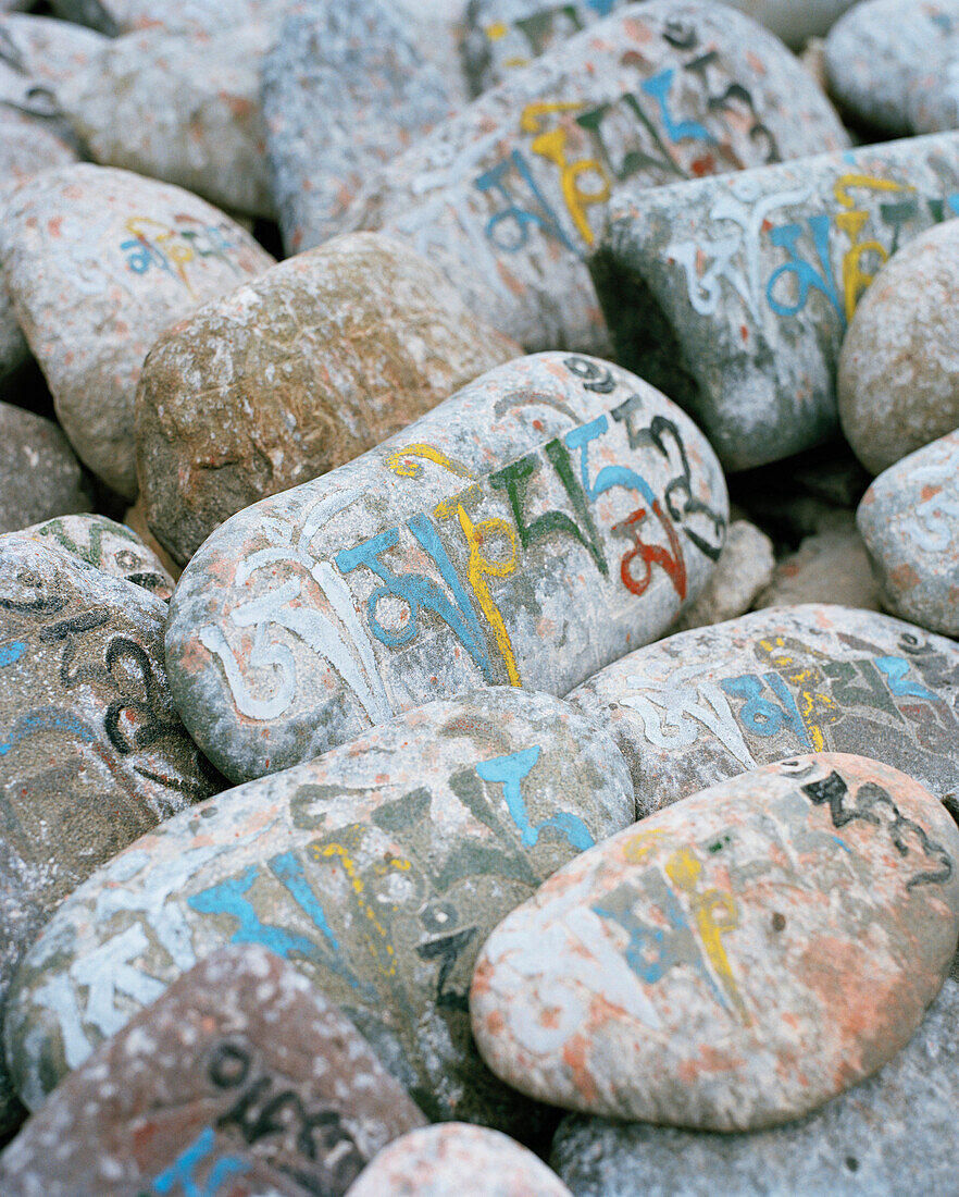 Om mani padme hung stones that got piled near the temple of Shey Palace by religious people, Ladakh, Jammu and Kashmir, India