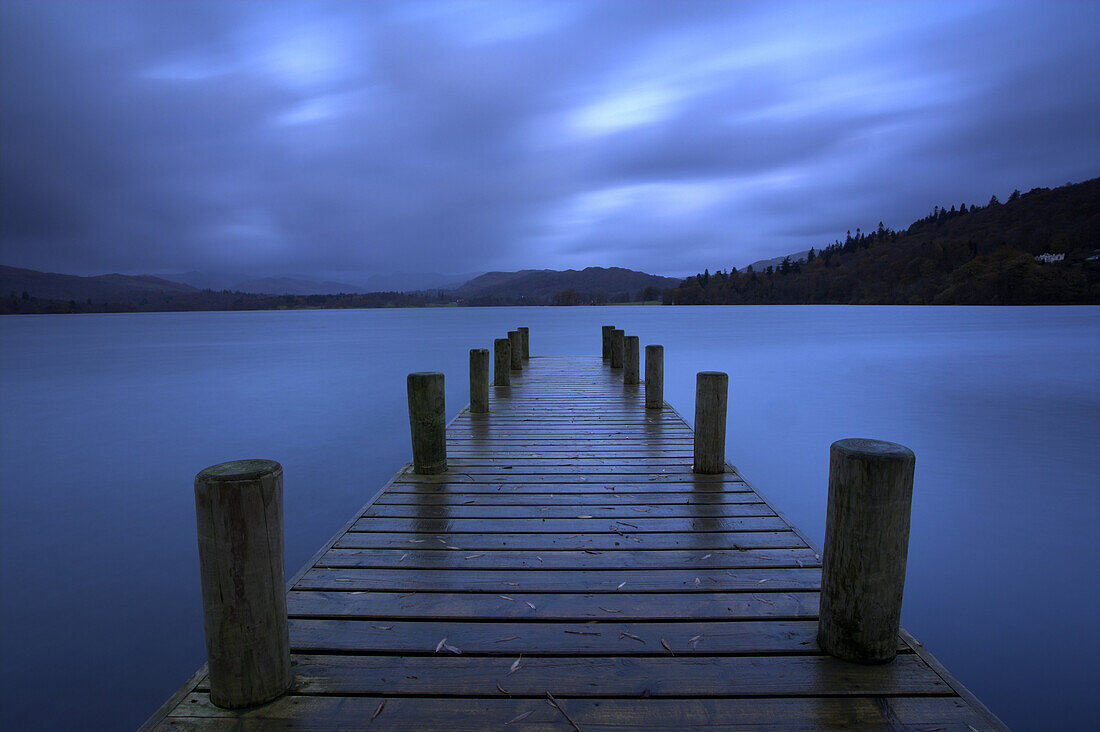 Wooden jetty at dawn on Lake Windermere, Lake District National Park, Cumbria, UK