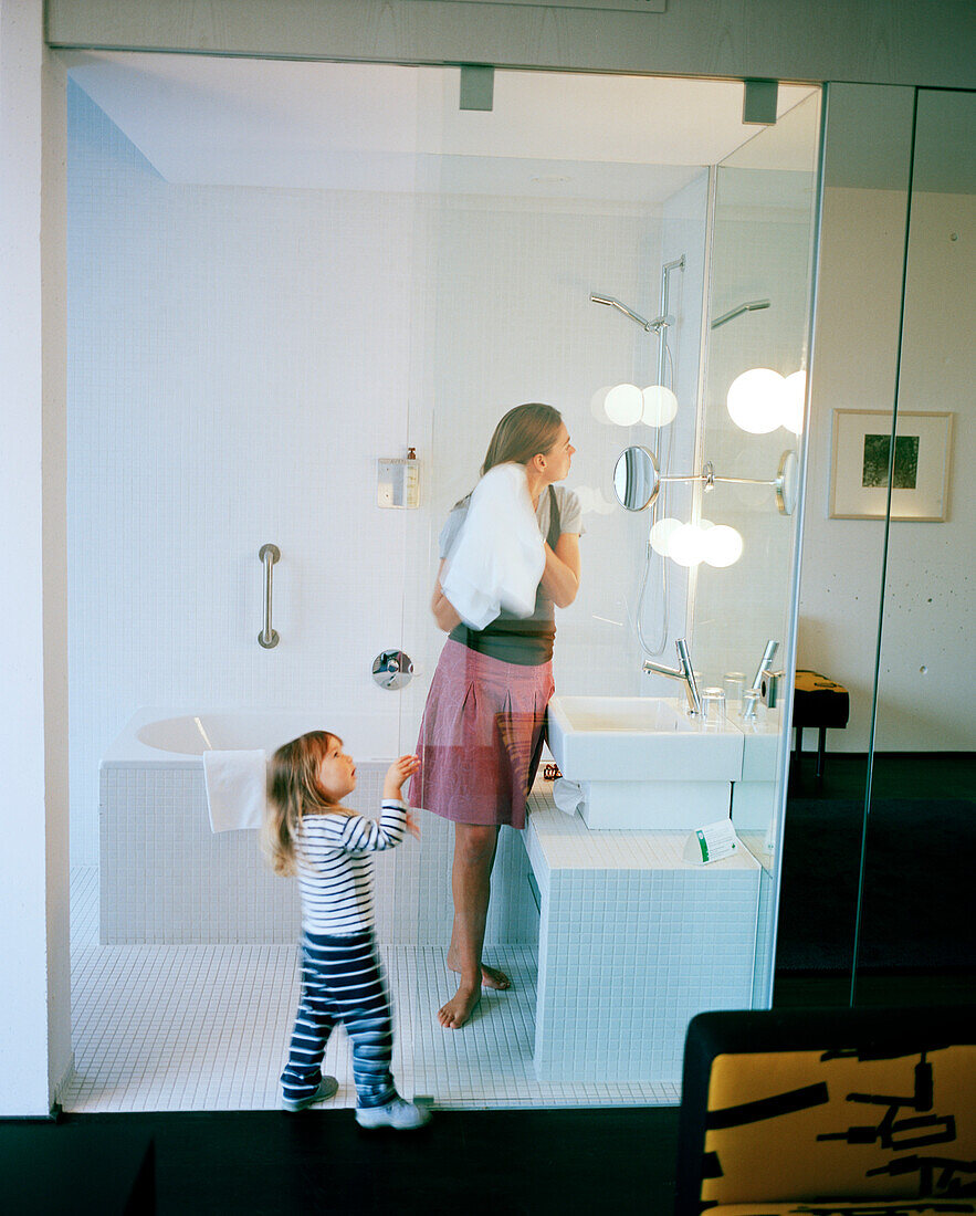Mother and daughter in a bathroom of a hotel room, Langenlois, Lower Austria, Austria