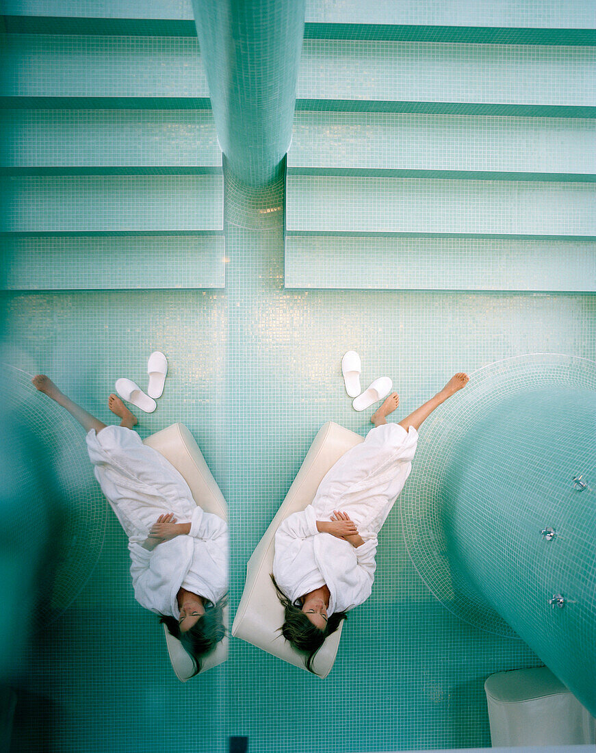 Woman on a lounger in relaxation room of a spa, Langenlois, Lower Austria, Austria