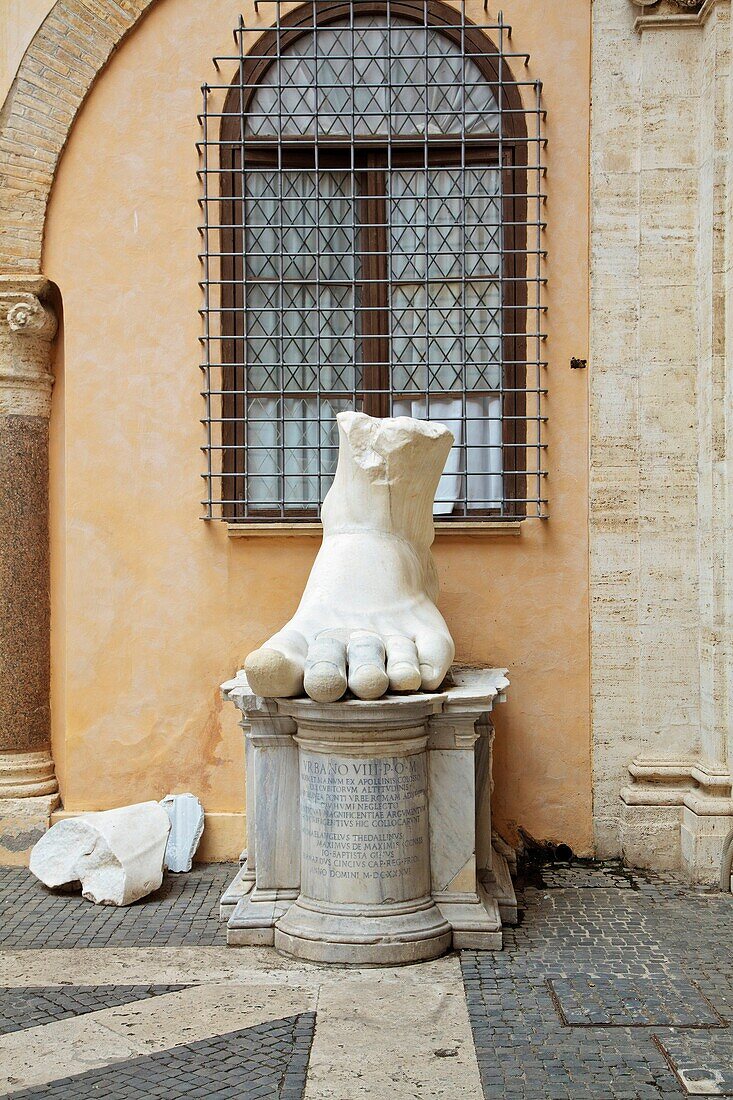 Parts of the Colossal statue of Constantine in the Capitoline Museum, Rome, Italy  Roman antiquities displayed in courtyard