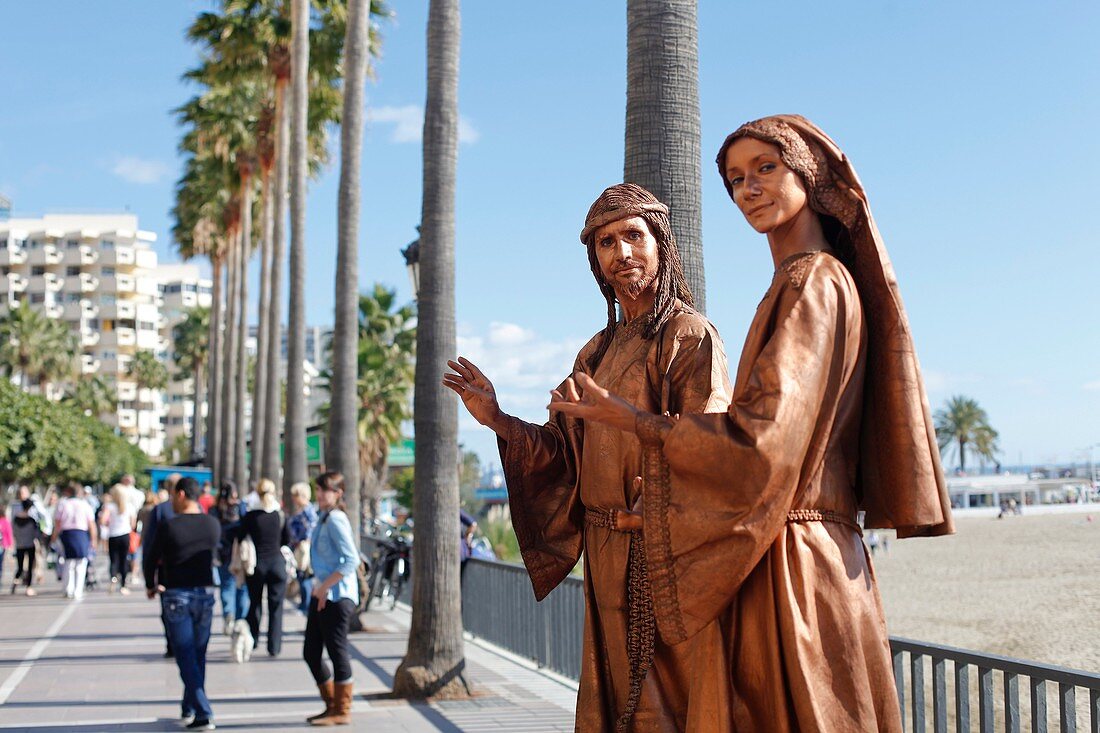 Street mimes at the seafront of Marbella, Spain