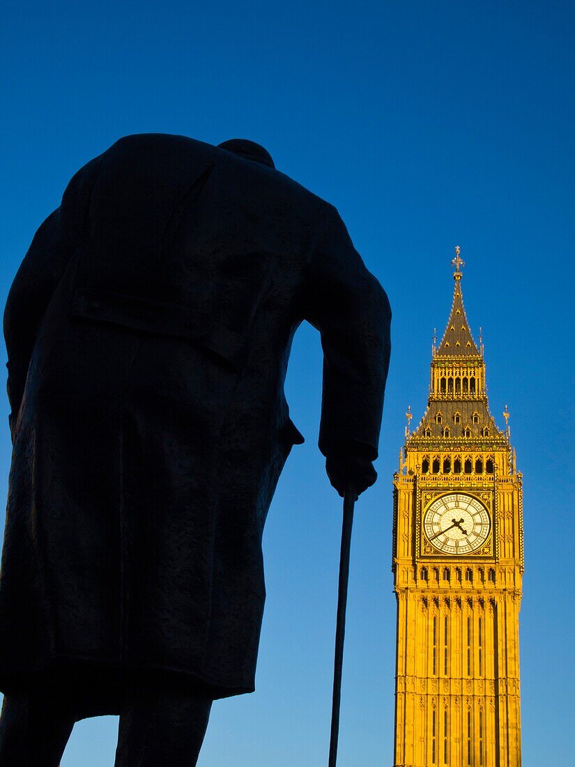 England, Greater London, City of Westminster  Churchill statue and the iconic Big Ben also known as the Clock Tower, part of the House of Parliament building also known as the Palace of Westminster, located in the City of Westminster, London