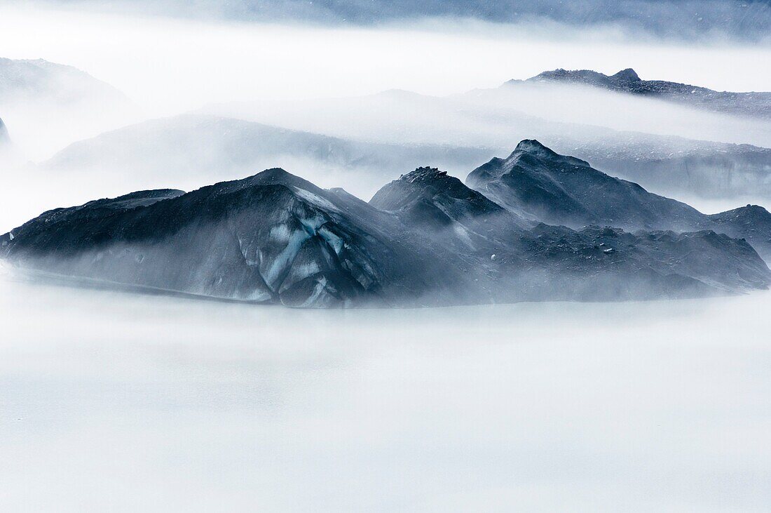 Mist forming among Icebergs at glacial lake in Mount Cook national park, New Zealand