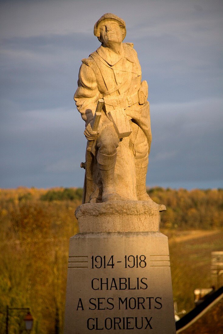 Sunset on the war memorial of the first and second world wars in Chablis, Yonne 89, in Burgundy