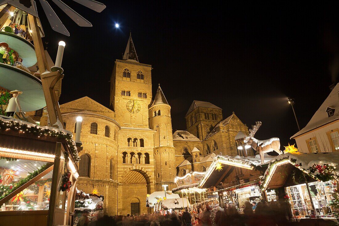 Cathedral of Trier and Chistmas market with snow at night, Trier, Germany