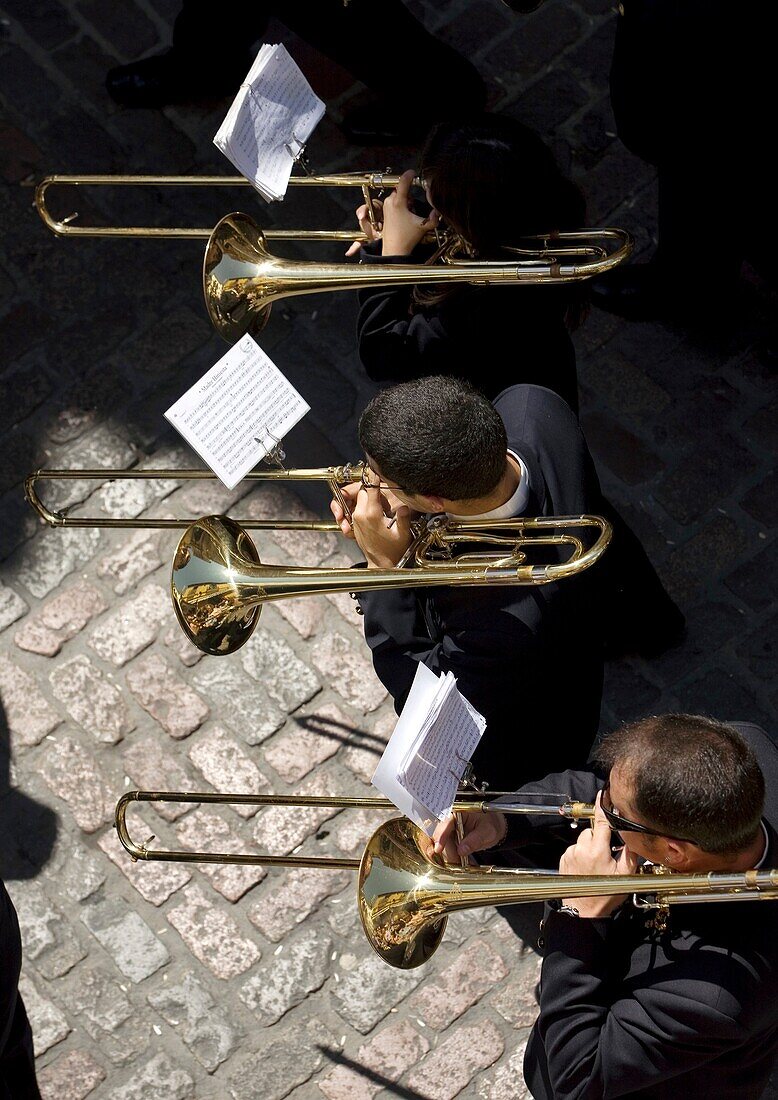 Members of music band performs in an Easter Holy Week procession in Cordoba, Andalusia, Spain, April 17, 2011