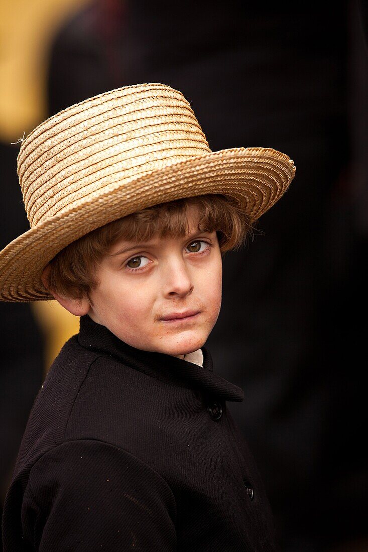 Amish boy during the Annual Mud Sale to support the Fire Department in Gordonville, PA